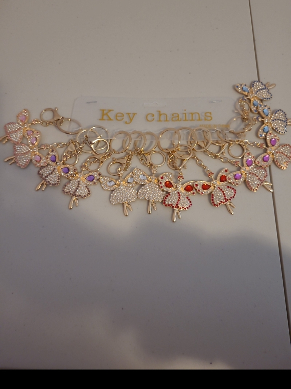 Gold Fairy Charm Keychain with Red and Pink Accents